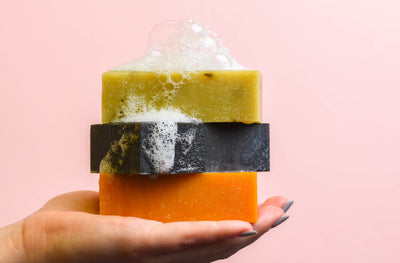 soap bars in hand