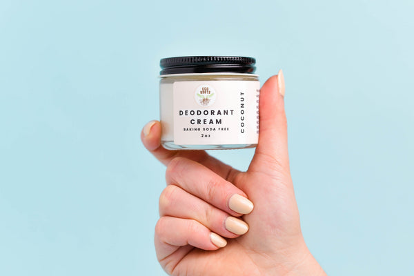deodorant cream in hand