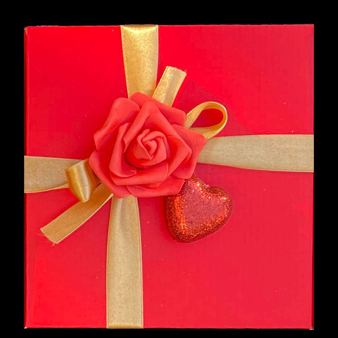 Red Gift box with Gold Ribbon decorated with Rose and heart 