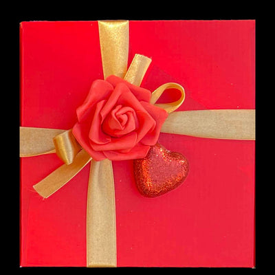 Red Gift box with Gold Ribbon decorated with Rose and heart 