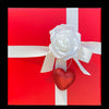Red Gift box with White Ribbon decorated with Rose and heart 