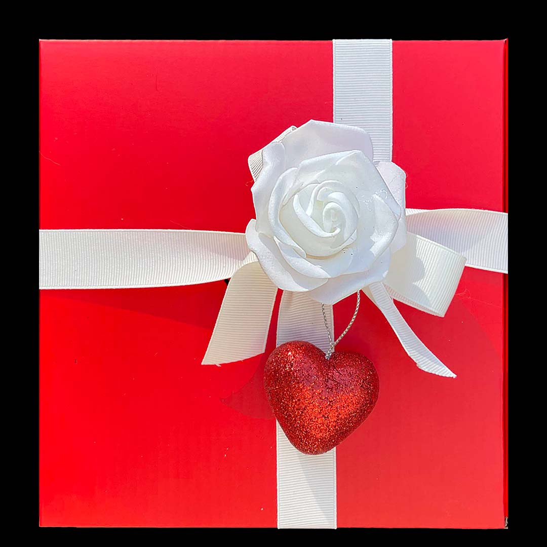 Red Gift box with White Ribbon decorated with Rose and heart 